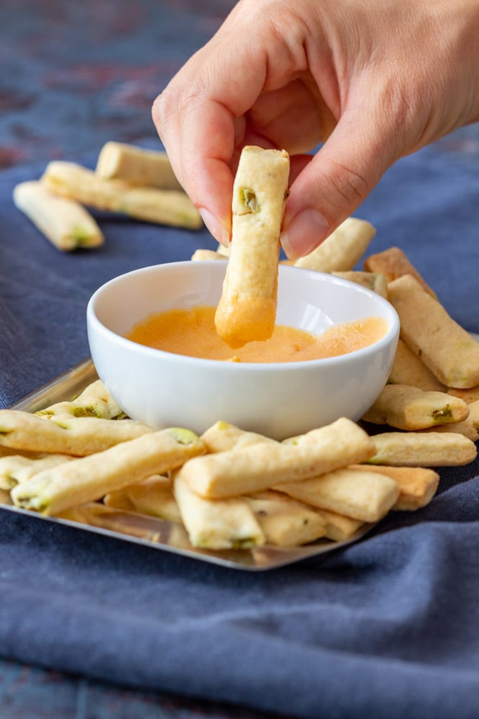 Dipping to the sauce mini jalapeno breadsticks.