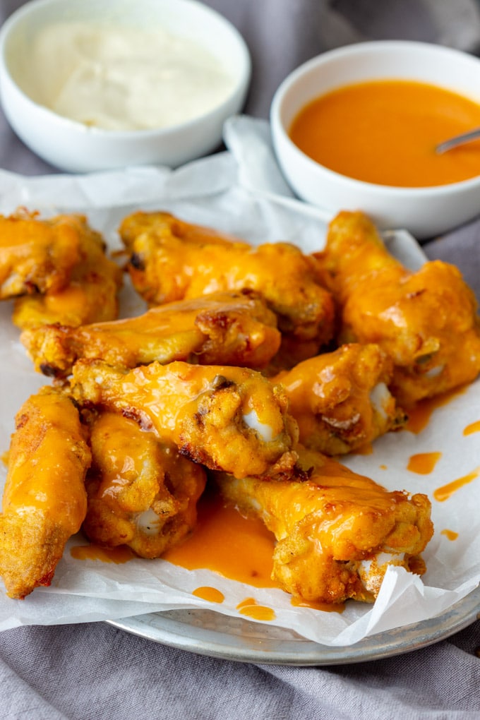 Baked chicken wings with spicy Buffalo sauce.