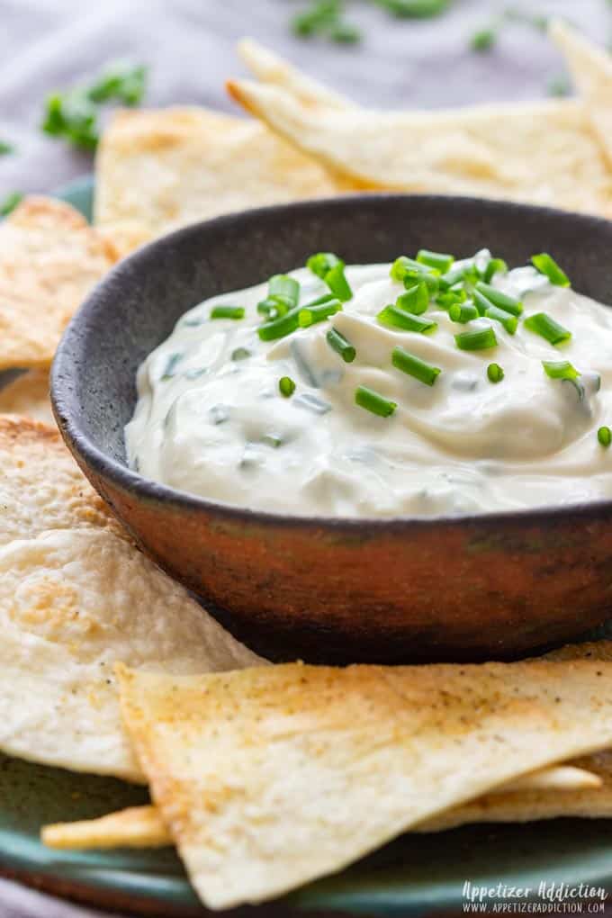 Small bowl of homemade sour cream and chive dip.