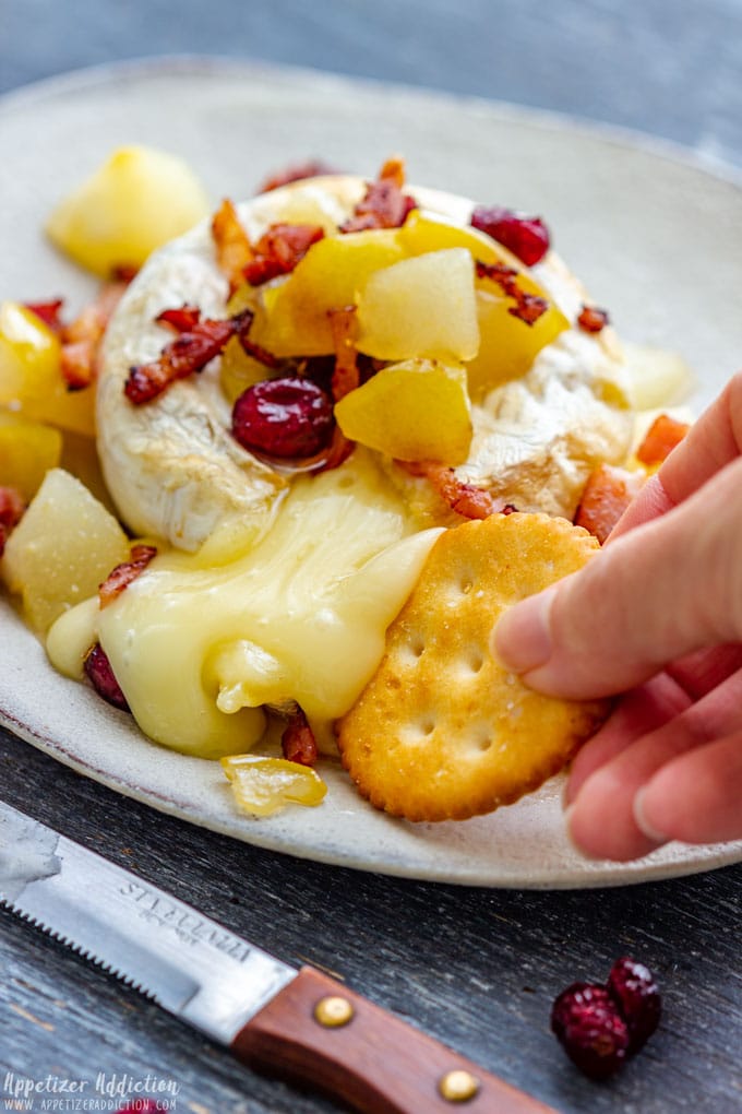 Scooping Up Baked Brie with Cracker