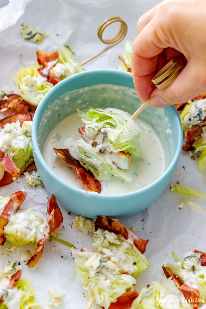 Wedge salad on a stick with dressing.