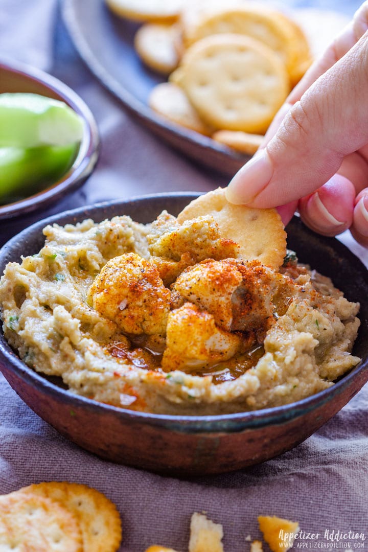 Scooping Roasted Eggplant Dip With Cheese Crackers