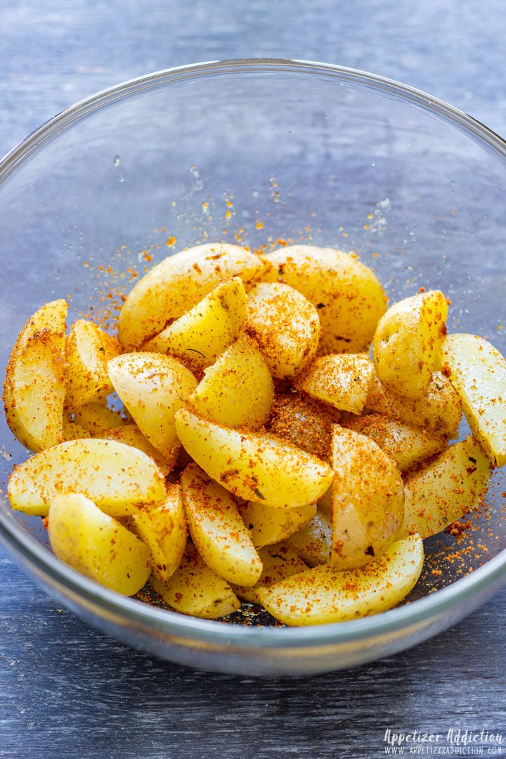 Seasoned baby potatoes in the glass bowl