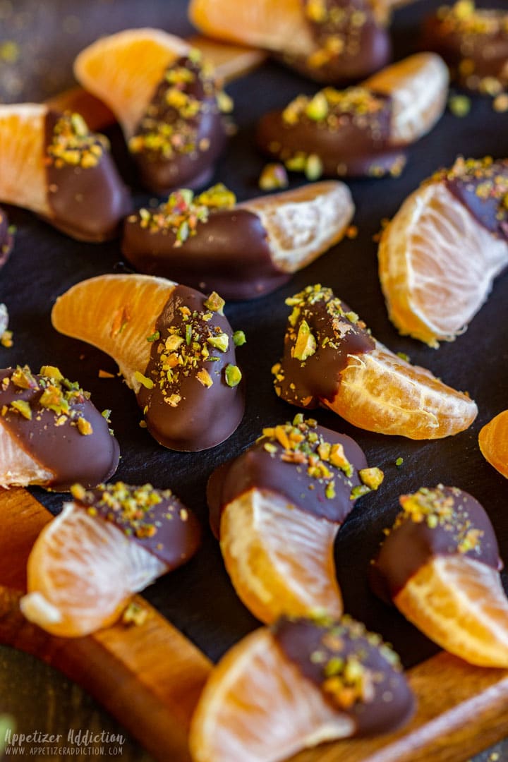 Chocolate dipped mandarin slices with pistachios