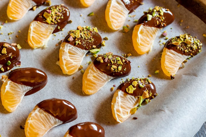 Making chocolate dipped mandarins