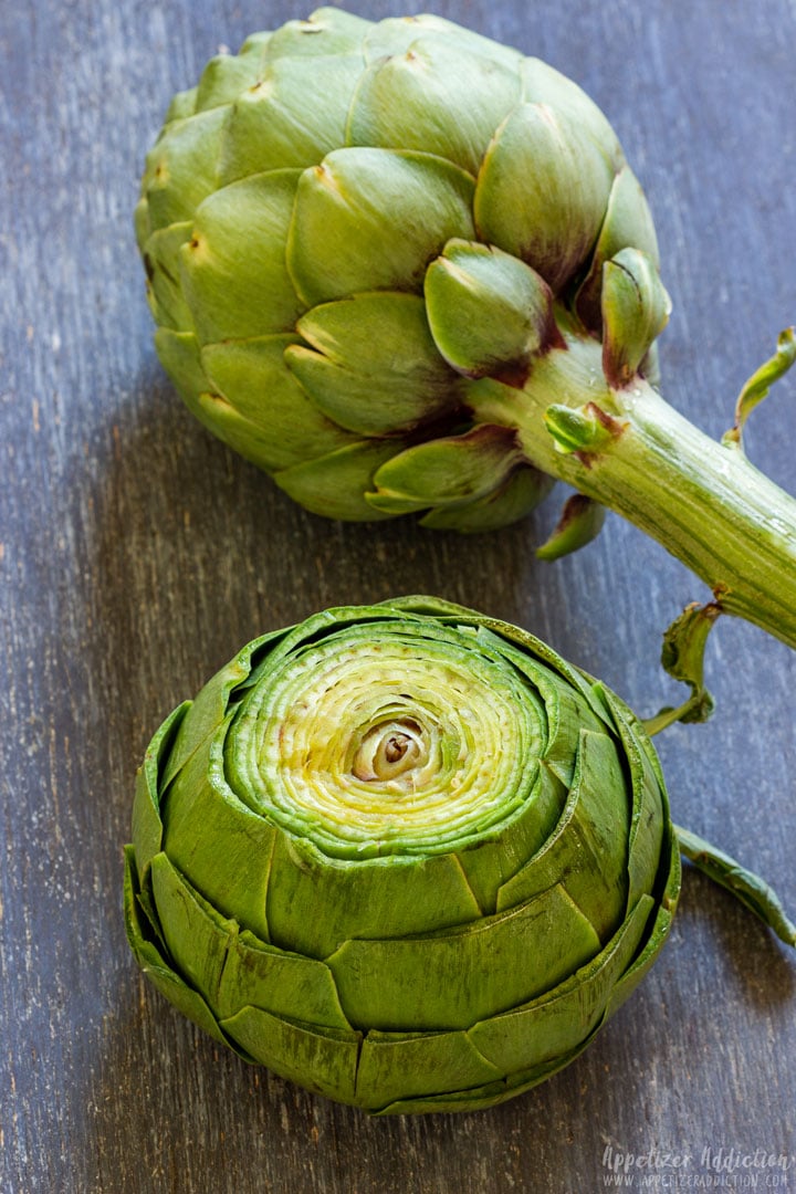 Full artichoke and cut half artichoke