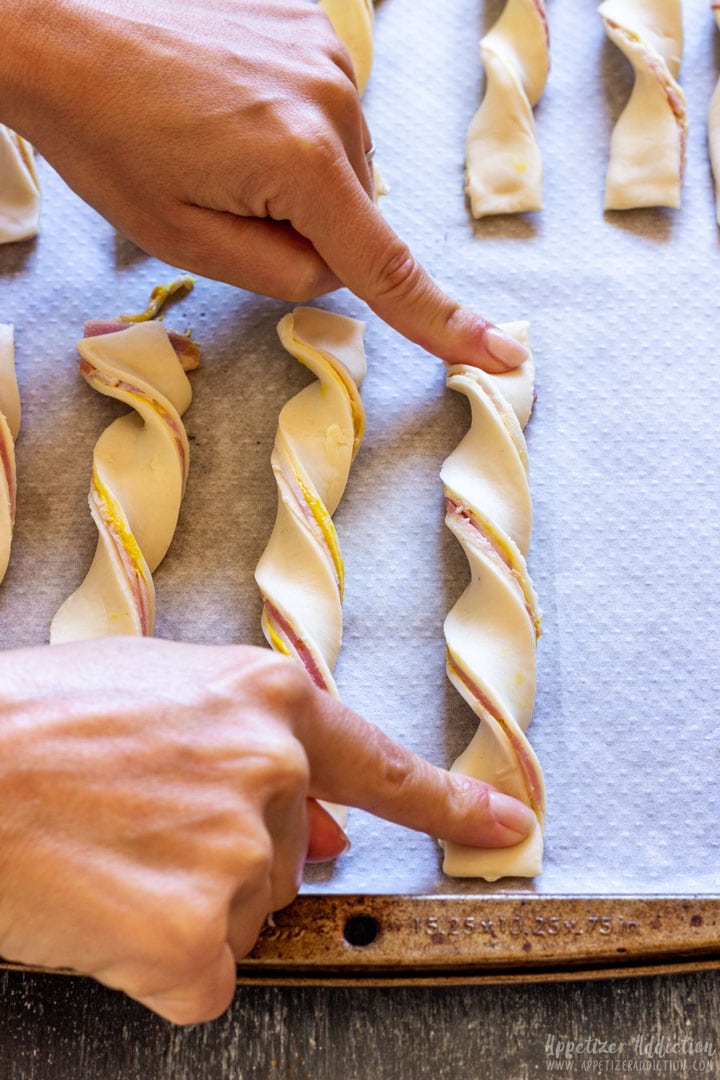 Showing how to twist puff pastry