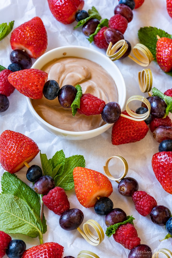 Colorful fruit kabob skewers with homemade dip