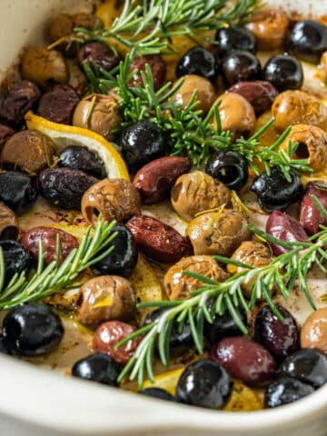 Oven baked olives in baking dish