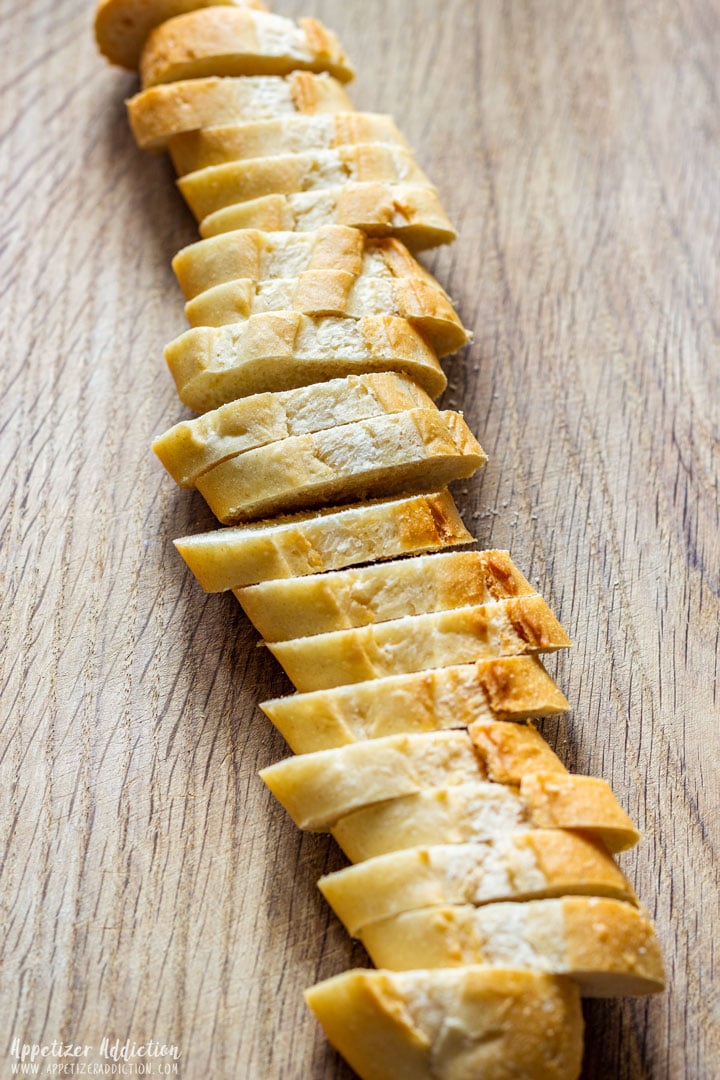 Sliced baguette on the wooden board