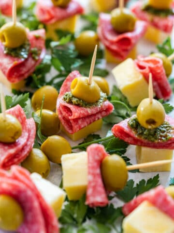 Salami and cheese skewers with olives