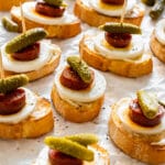 Easy party appetizers crostini with chorizo sausage, egg and pickles