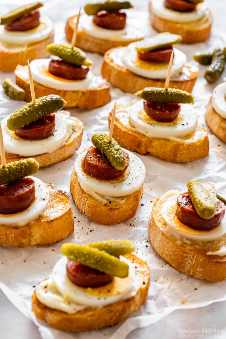 Easy party appetizers crostini with chorizo sausage, egg and pickles