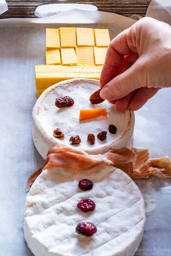 Assembling the snowman for cheese board