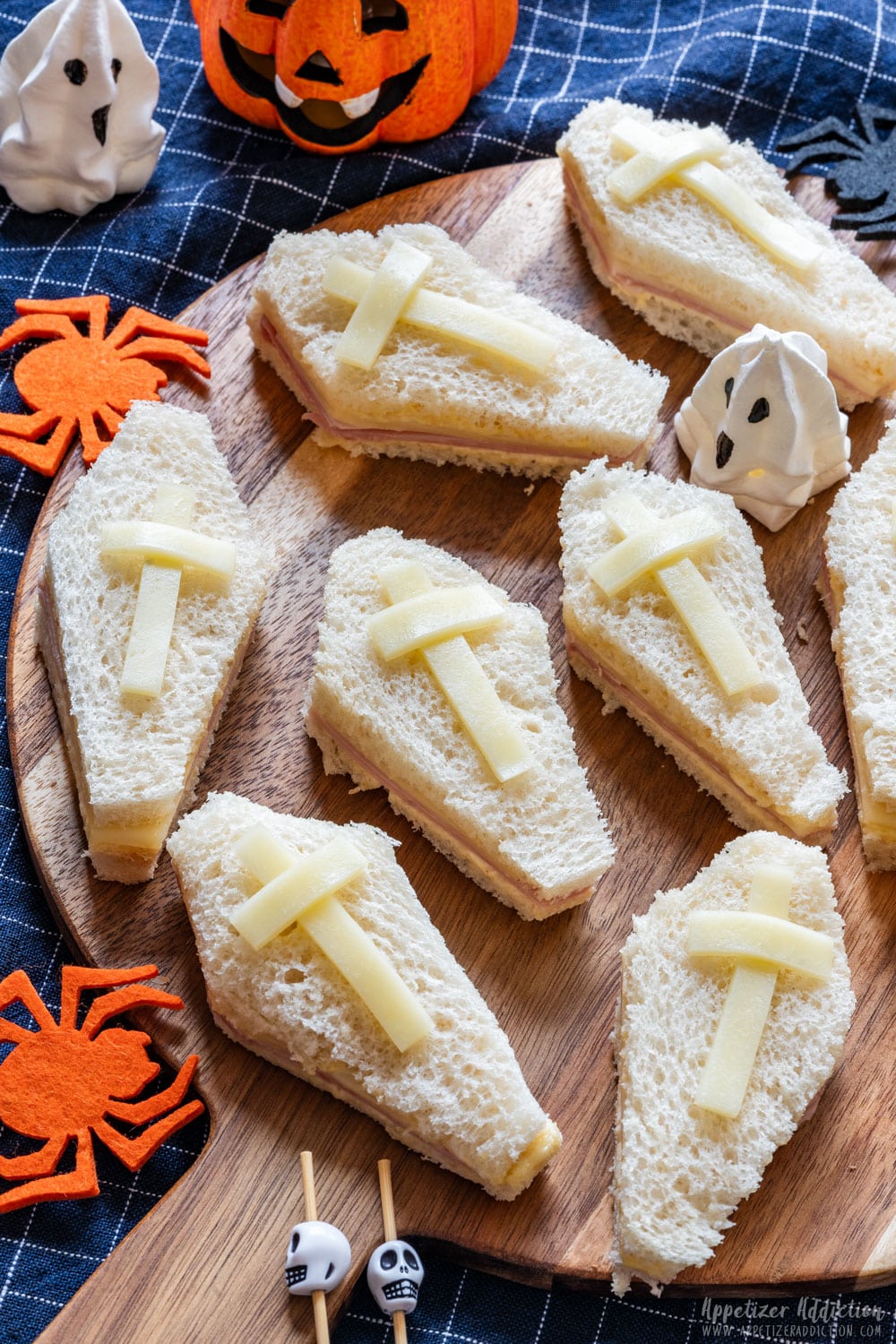 Halloween coffin sandwiches with spiders, ghost and pumpkin.