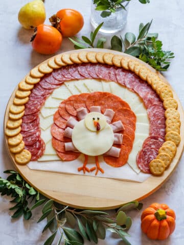 Turkey shaped charcuterie board for Thanksgiving.