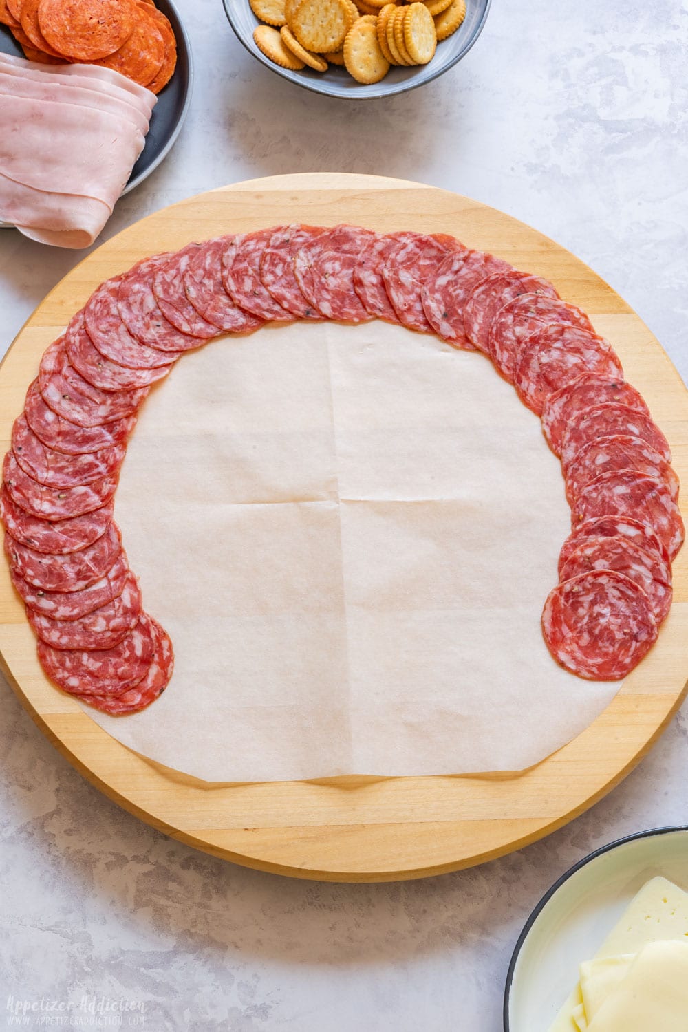 Salami slices arranged on the platter in a half circle.
