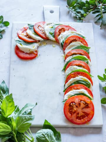 Tomato, basil and mozzarella appetizer - candy cane Caprese board.