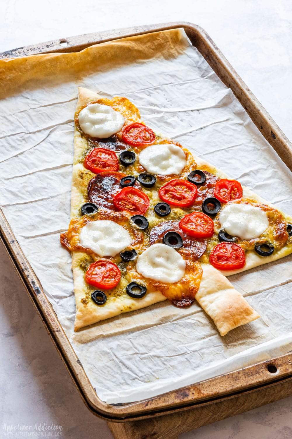 Freshly baked Christmas tree-shaped pizza.