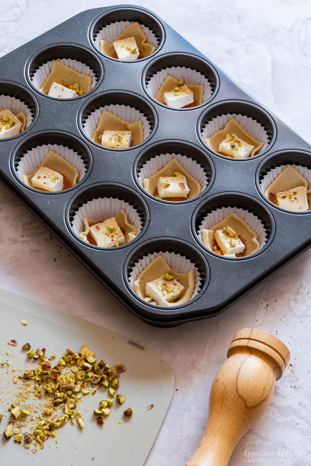 Puff pastry brie bites before baking.