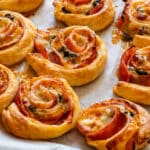 Ham and cheese pinwheels with sweet chili sauce.