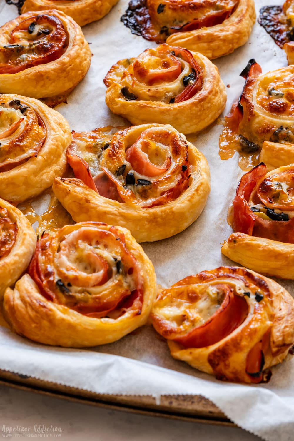 Ham and cheese pinwheels with sweet chili sauce.