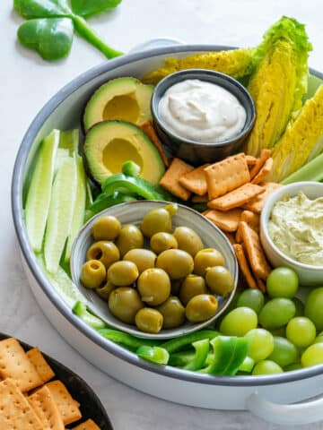 Green snack board with dip for St. Patrick’s Day.