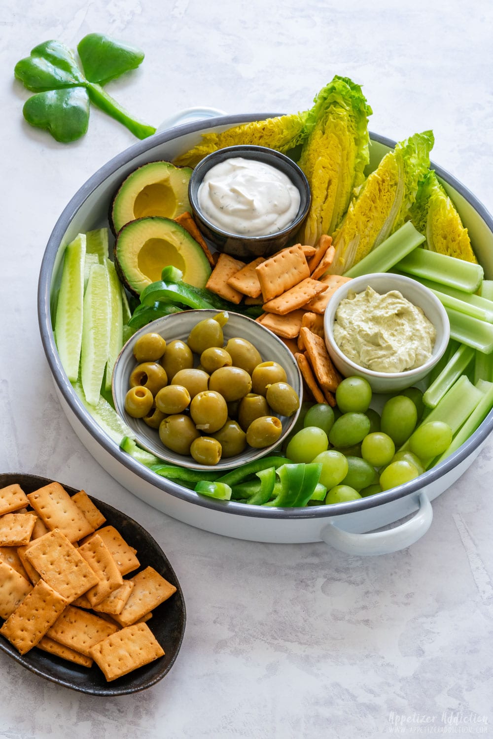 St. Patrick's Day green snack board with Irish shamrock made from green bell pepper.