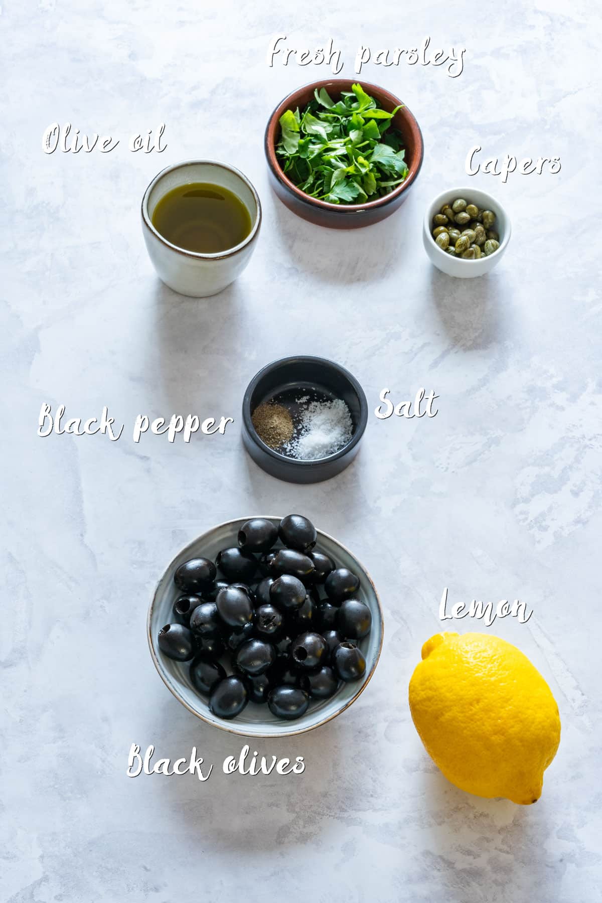 Ingredients of tapenade on the table.