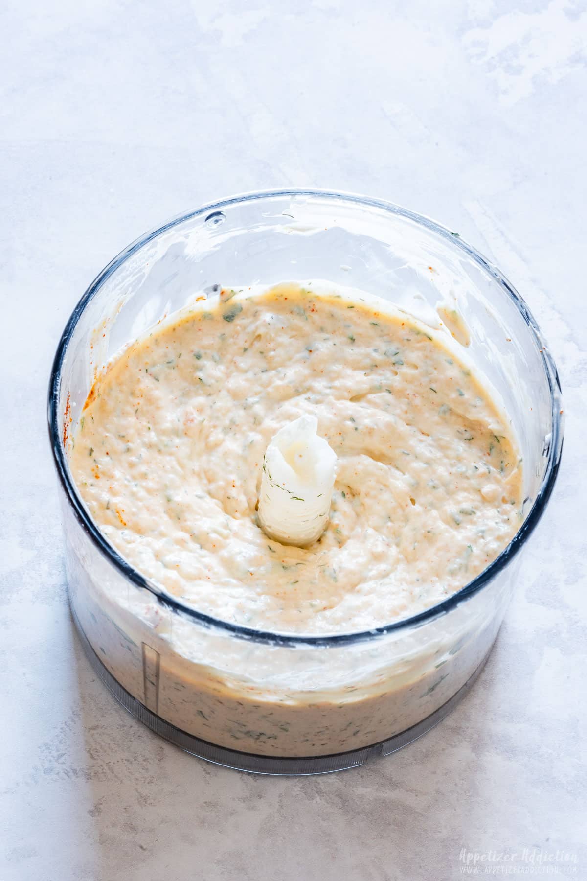 Smoked salmon dip in food processor bowl.