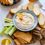 Snack board with smoked salmon dip, perfect party food for easy entertaining.
