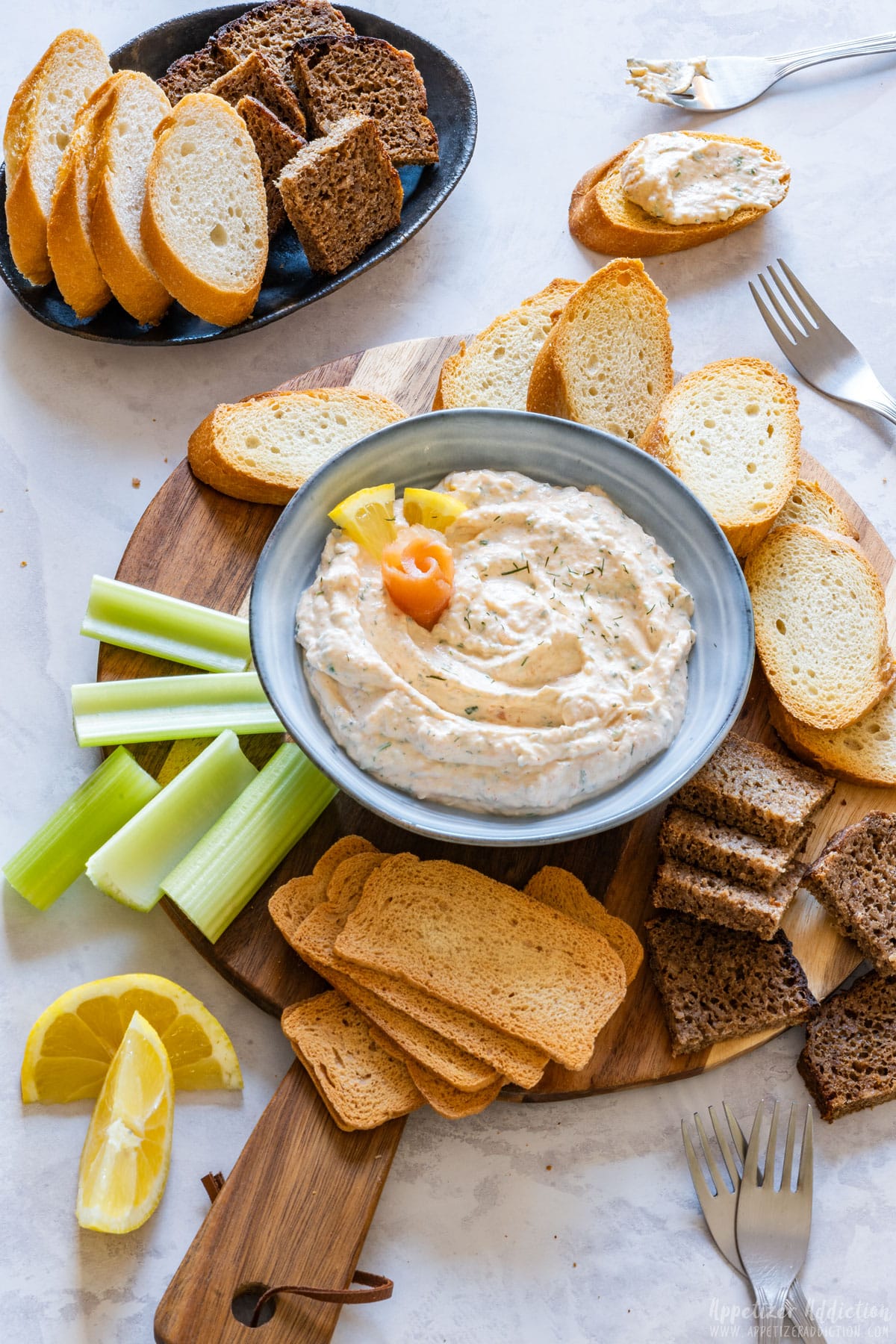 Snack board with smoked salmon dip, perfect party food for easy entertaining.