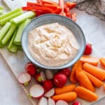 Vegetable dip with carrots, celery, peppers and radish.