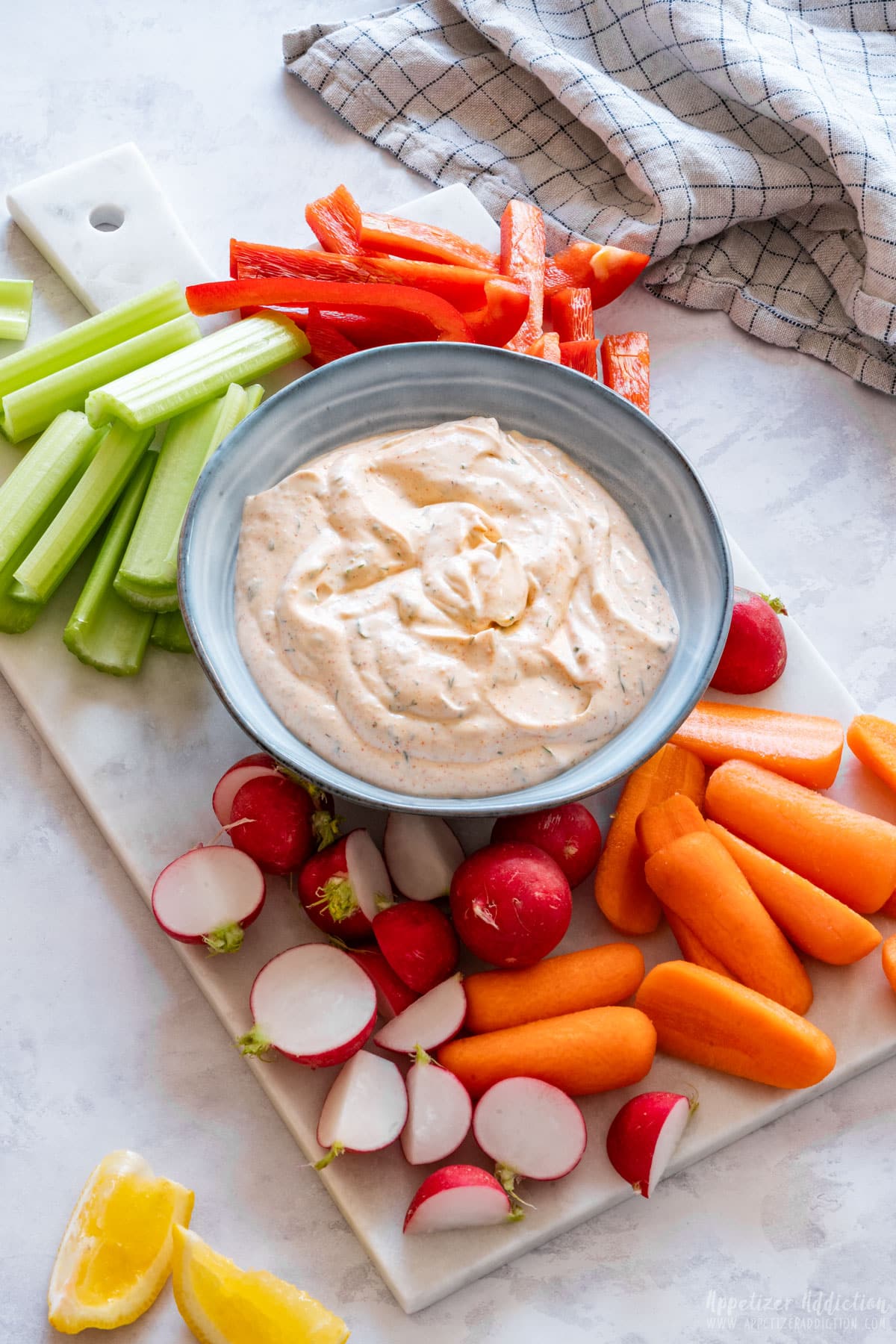 Vegetable dip with carrots, celery, peppers and radish.