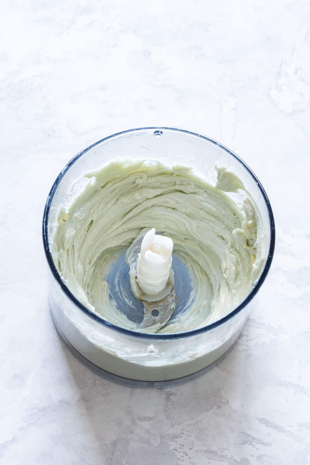 Smooth blue cheese and cream cheese mixture blended in a food processor.