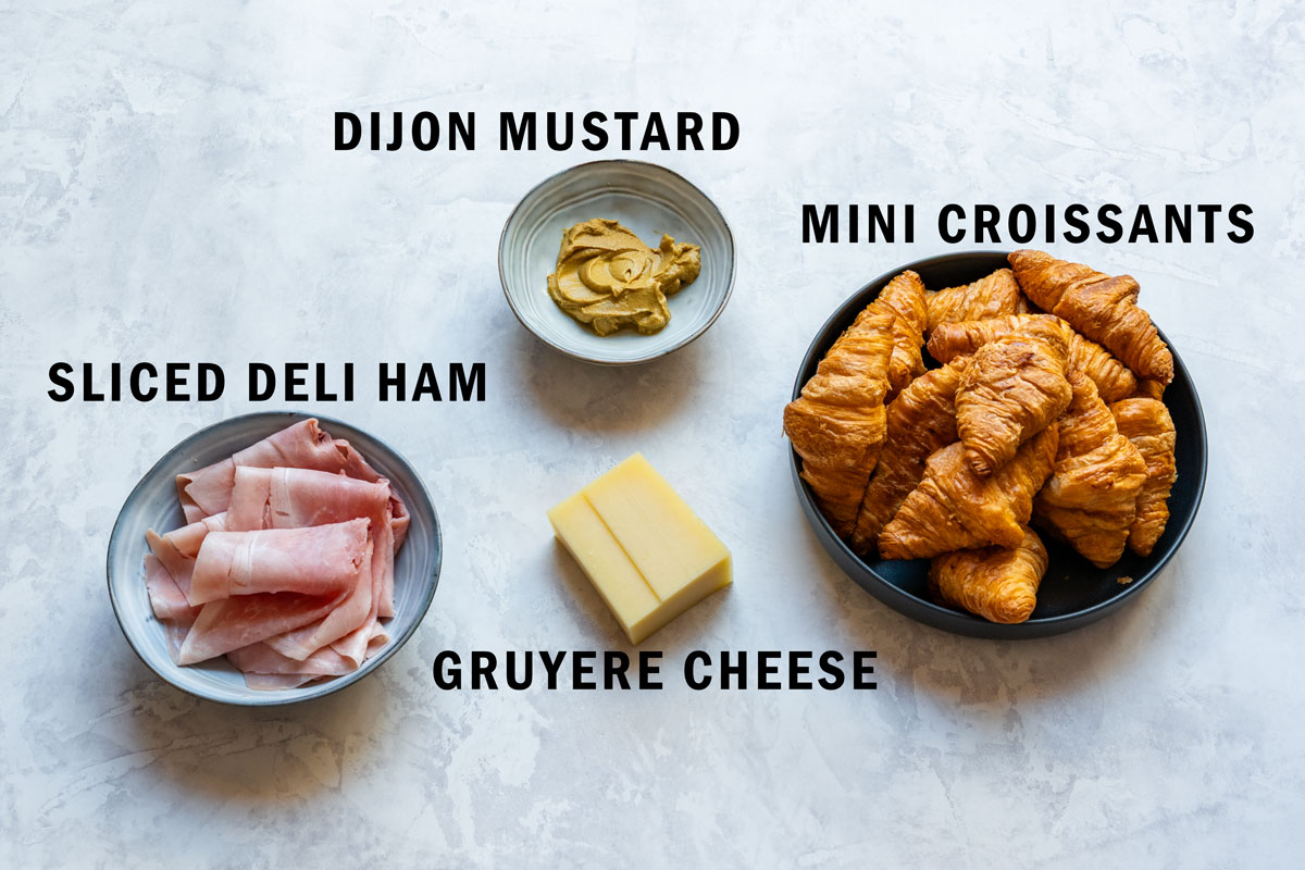 The four ingredients: mini croissants, sliced deli ham, a block of Gruyère and Dijon mustard.